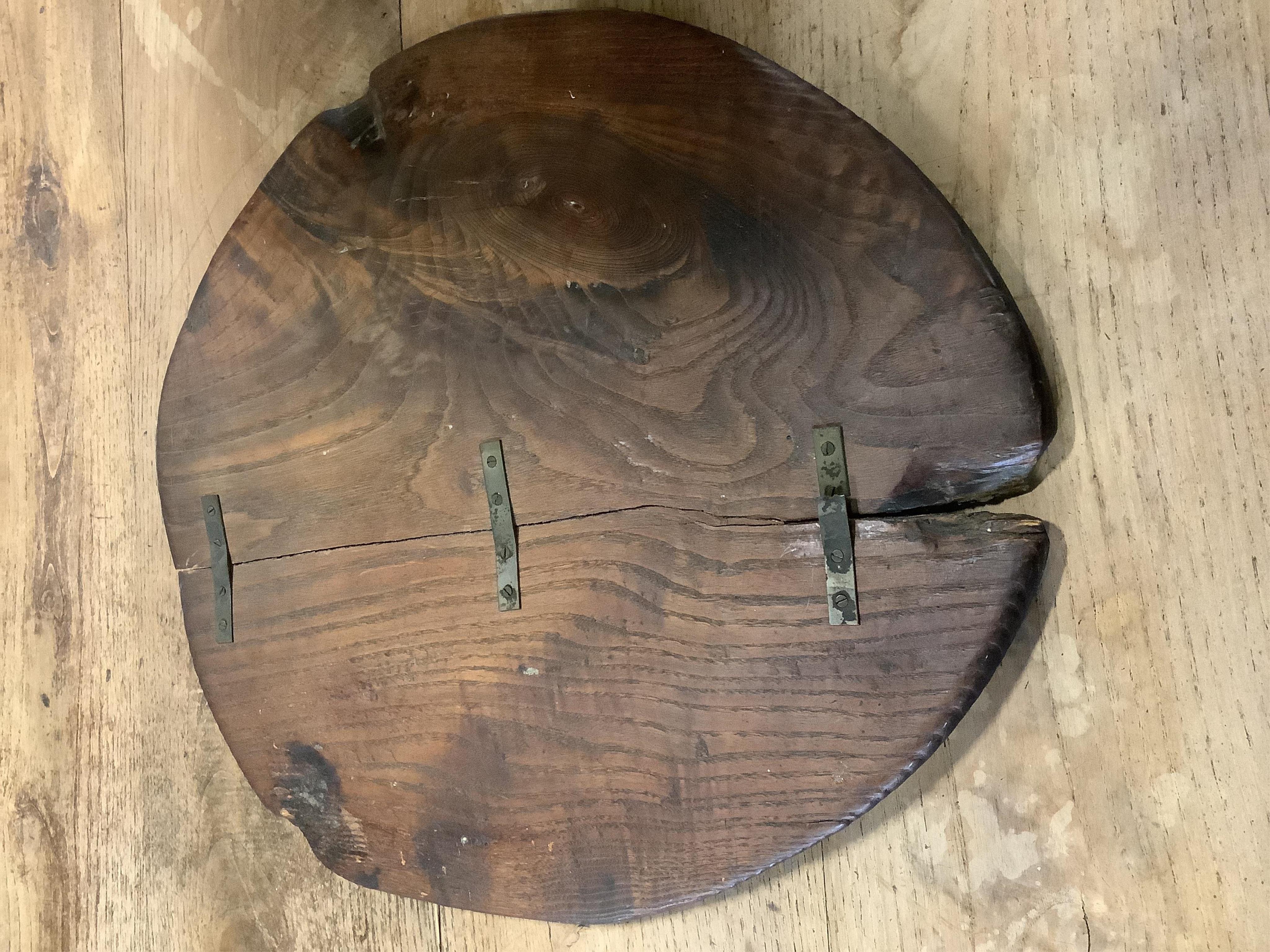 An unusual 18th century weathered elm cricket table, width 61cm, height 60cm. Condition - fair to good